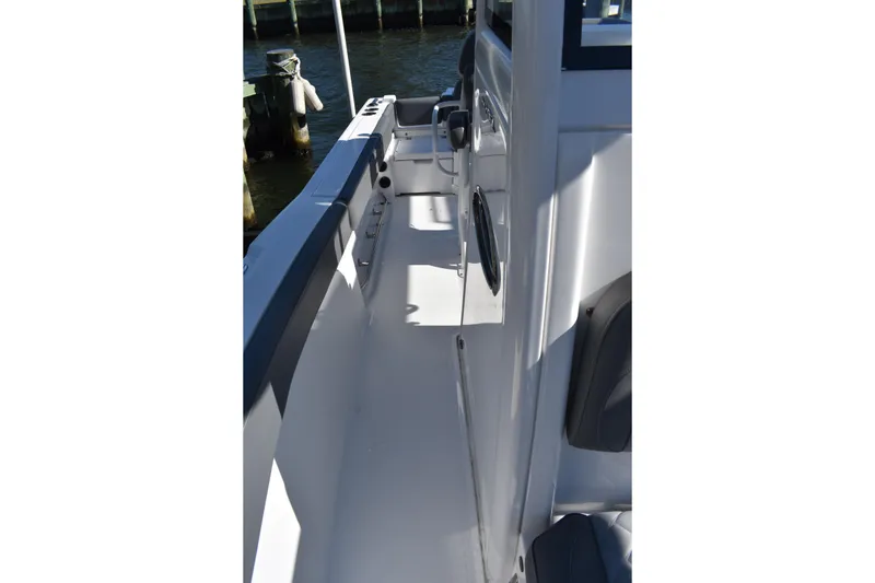 Slide: The Image of 2025 NauticStar 242L Offshore boat deck, featuring sleek design and modern amenities. - 50