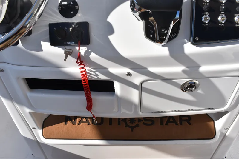 Slide: The Image of Control panel of 2025 NauticStar 231 Hybrid boat with Yamaha ignition key. - 41