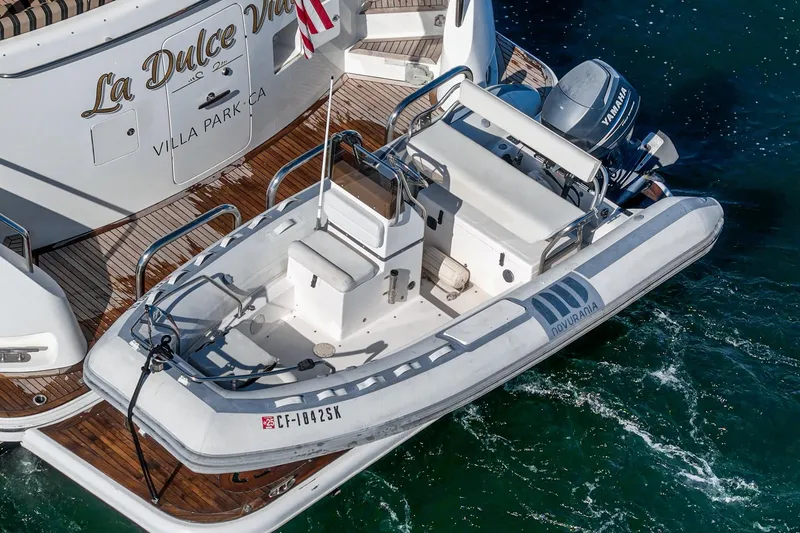 Slide: The Image of Ocean Alexander 2010 motor yacht with tender boat, docked on wooden deck. - 13