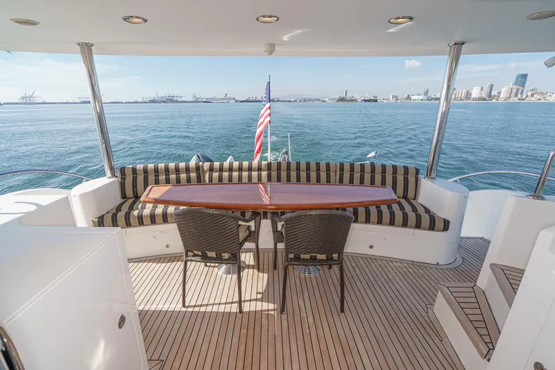 Slide: The Image of 2010 Ocean Alexander Motor Yacht deck with seating, table, and ocean view. - 17