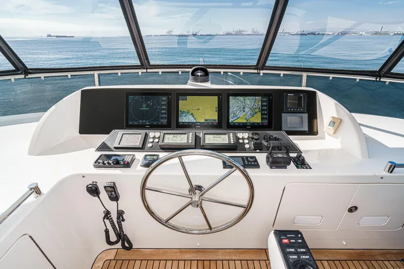 Slide: The Image of Cockpit of 2010 Ocean Alexander Motor Yacht with navigation screens and steering wheel. - 22