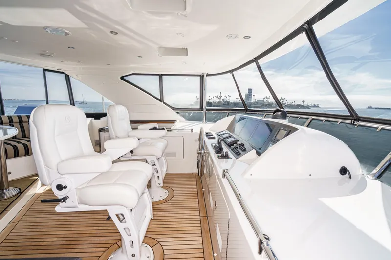 Slide: The Image of Luxurious 2010 Ocean Alexander motor yacht helm with white seating and panoramic ocean views. - 23