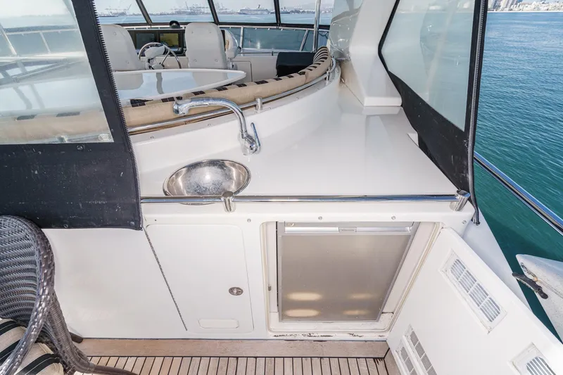 Slide: The Image of 2010 Ocean Alexander Motor Yacht deck with sink and seating area. - 26