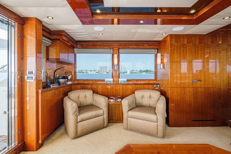 Slide: The Image of Luxurious 2010 Ocean Alexander Motor Yacht interior with plush seating and elegant wood paneling. - 34
