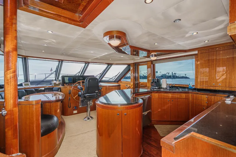 Slide: The Image of Luxurious 2010 Ocean Alexander motor yacht interior with elegant wood finishes and panoramic windows. - 38