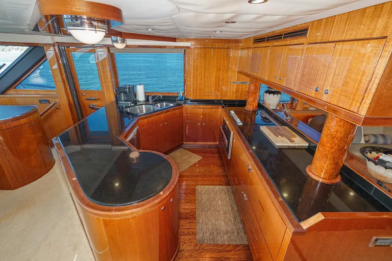 Slide: The Image of Luxurious 2010 Ocean Alexander motor yacht kitchen with wood cabinetry and ocean view. - 39