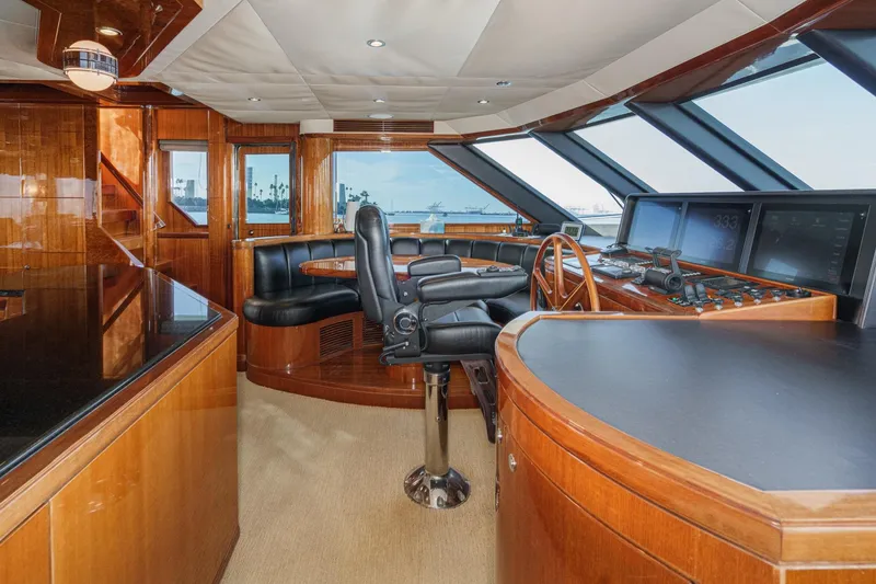 Slide: The Image of Luxurious helm of 2010 Ocean Alexander Motor Yacht with panoramic windows and leather seating. - 45