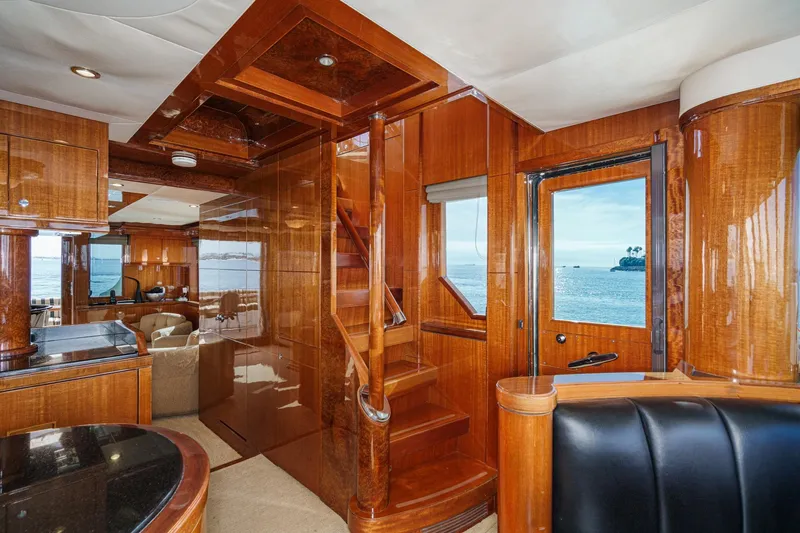 Slide: The Image of Luxurious 2010 Ocean Alexander motor yacht interior with polished wood and ocean view. - 50