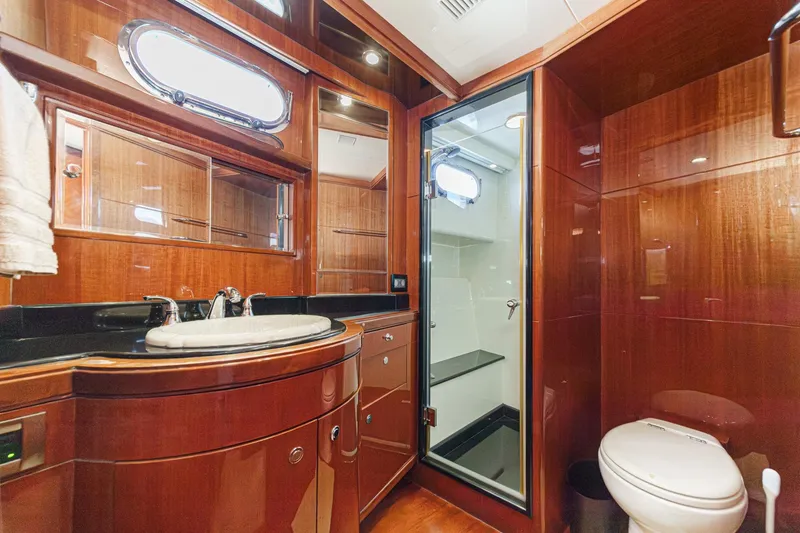 Slide: The Image of Luxurious 2010 Ocean Alexander motor yacht bathroom with wood finish and modern amenities. - 55