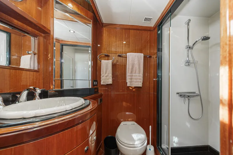 Slide: The Image of Luxurious bathroom in 2010 Ocean Alexander Motor Yacht with wood paneling and modern fixtures. - 58