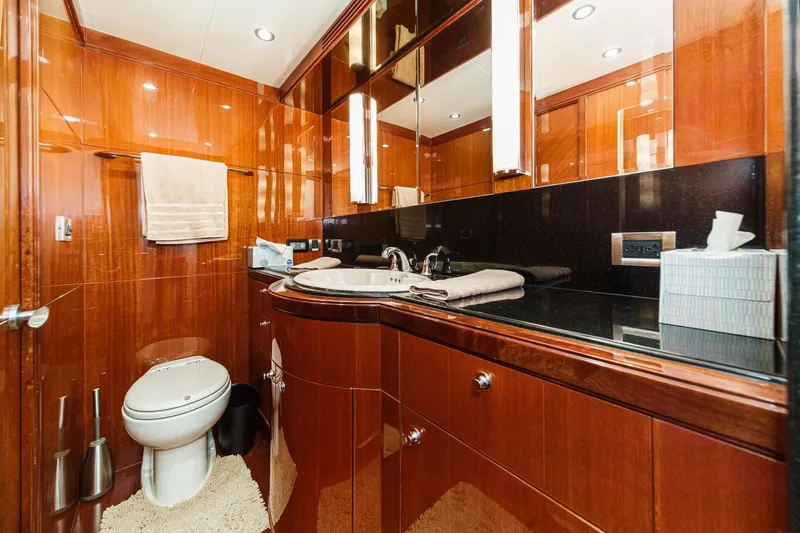 Slide: The Image of Luxurious 2010 Ocean Alexander motor yacht bathroom with elegant wood finish and modern fixtures. - 62