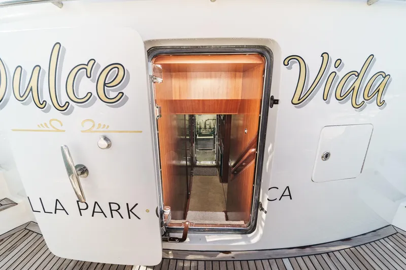 Slide: The Image of Entrance to 2010 Ocean Alexander Motor Yacht, featuring elegant wooden interior stairs. - 64