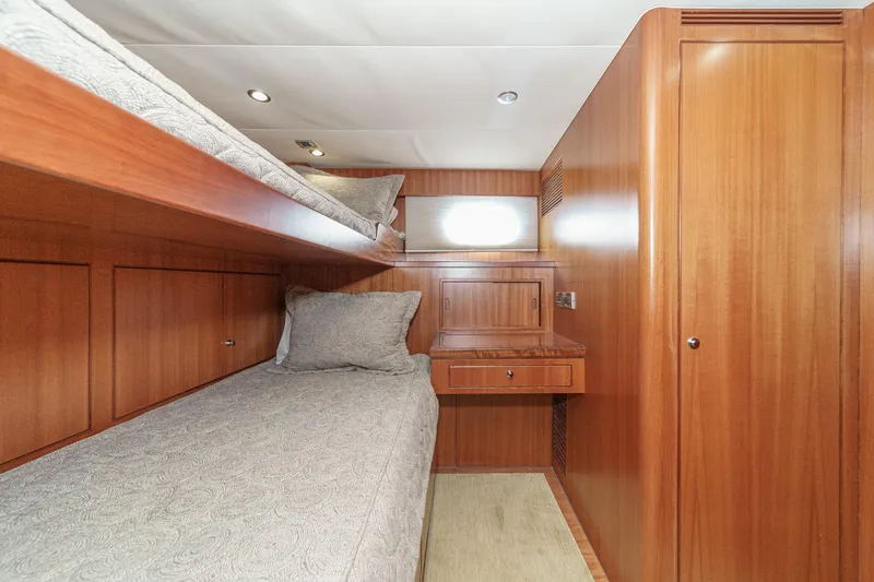 Slide: The Image of Luxurious 2010 Ocean Alexander motor yacht cabin with wooden interior and cozy bunk beds. - 66