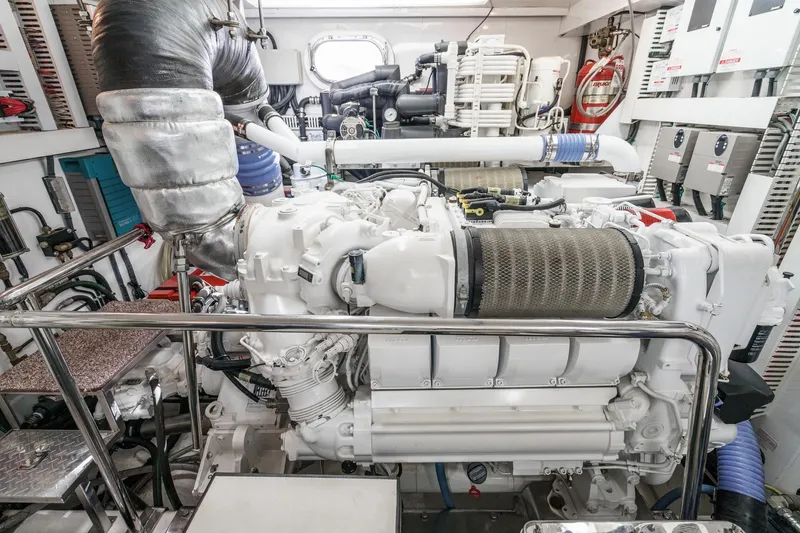 Slide: The Image of Engine room of a 2010 Ocean Alexander Motor Yacht, showcasing complex machinery and components. - 72