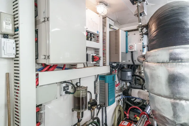 Slide: The Image of Engine room of a 2010 Ocean Alexander Motor Yacht, showcasing electrical systems and components. - 77