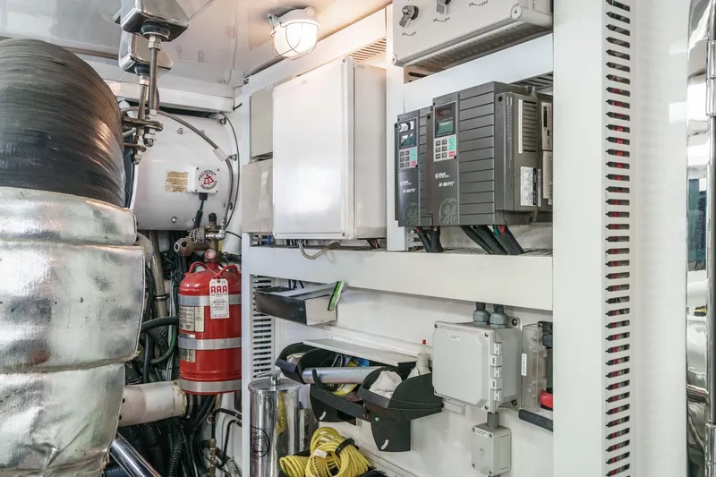 Slide: The Image of Engine room of 2010 Ocean Alexander Motor Yacht with equipment and fire extinguisher. - 81
