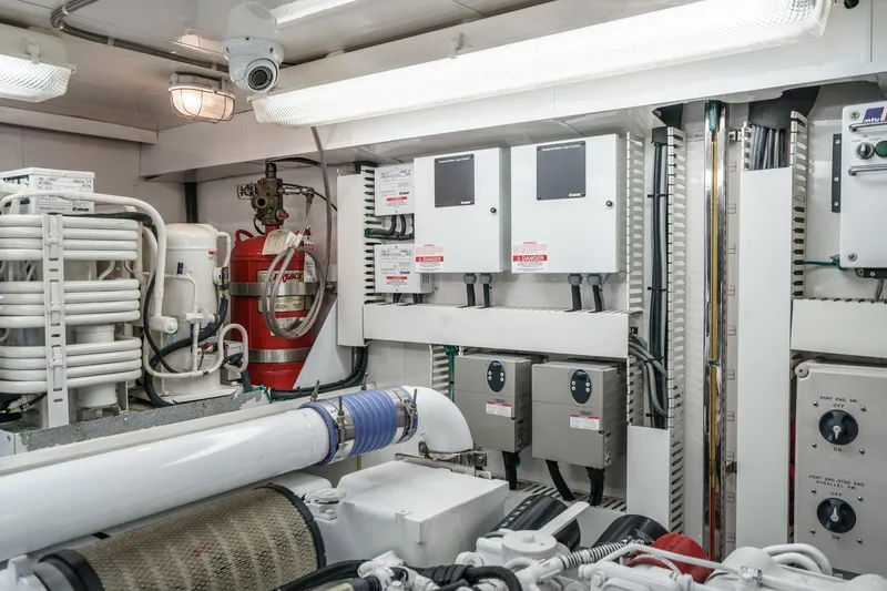 Slide: The Image of Engine room of 2010 Ocean Alexander Motor Yacht with control panels and safety equipment. - 84