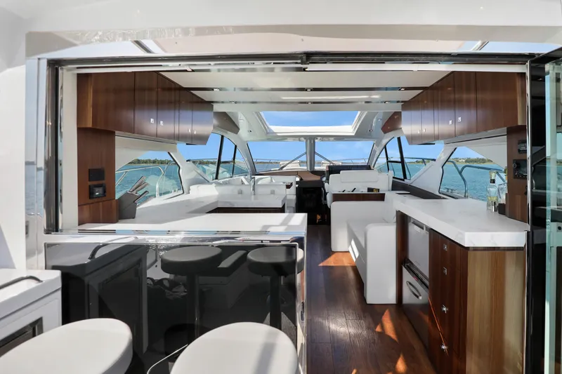 Slide: The Image of Luxurious interior of 2022 Cruisers Yachts 54 Cantius with modern design and ocean view. - 27