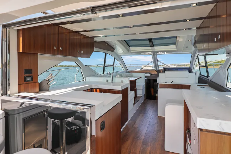 Slide: The Image of Luxurious interior of 2022 Cruisers Yachts 54 Cantius with modern design and panoramic windows. - 29