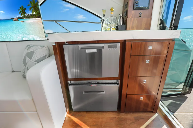 Slide: The Image of Luxurious interior of 2022 Cruisers Yachts 54 Cantius with modern kitchen amenities. - 43