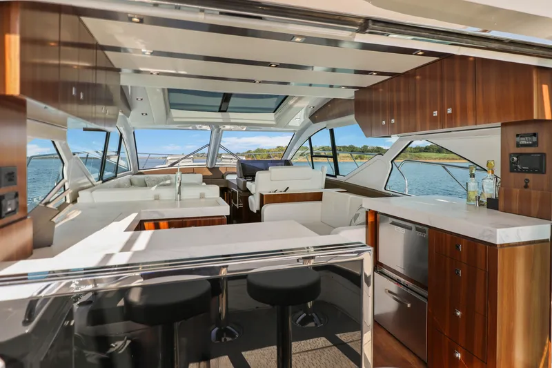 Slide: The Image of Luxurious interior of 2022 Cruisers Yachts 54 Cantius with modern design and scenic water view. - 49