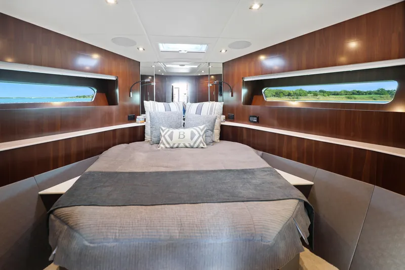 Slide: The Image of Luxurious bedroom interior of 2022 Cruisers Yachts 54 Cantius with elegant wood paneling. - 61