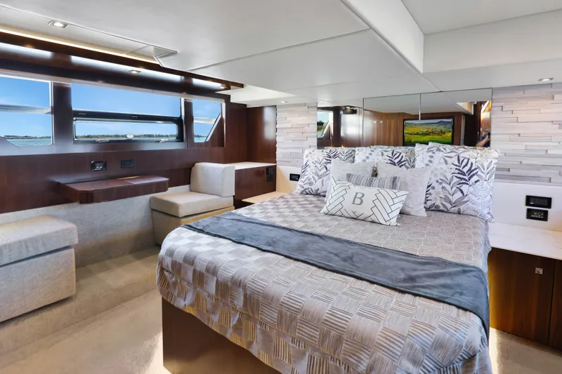 Slide: The Image of Luxurious bedroom interior of 2022 Cruisers Yachts 54 Cantius with elegant decor and scenic views. - 65