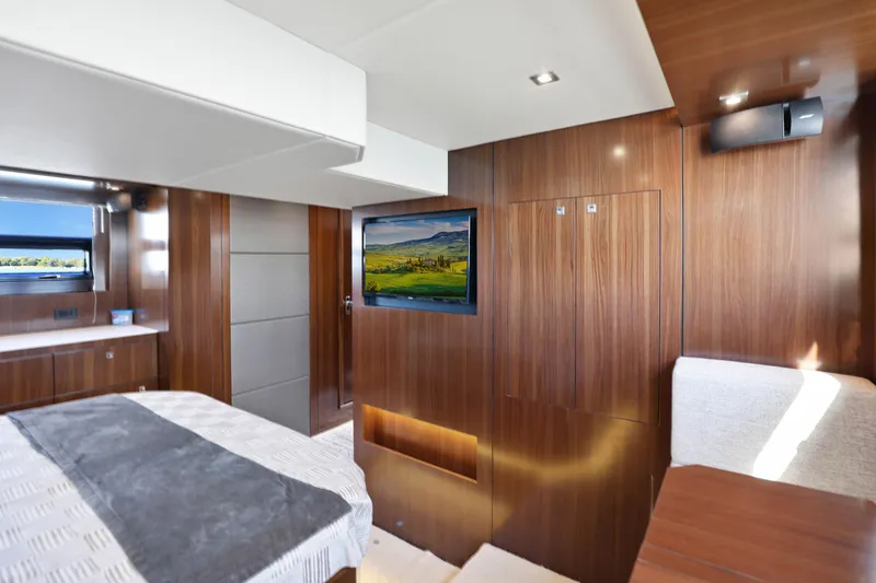 Slide: The Image of Luxurious interior of 2022 Cruisers Yachts 54 Cantius with wood paneling and modern amenities. - 67