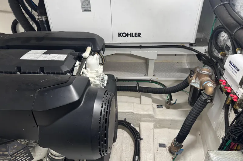 Slide: The Image of Engine room of 2022 Cruisers Yachts 54 Cantius with Kohler generator and plumbing. - 75