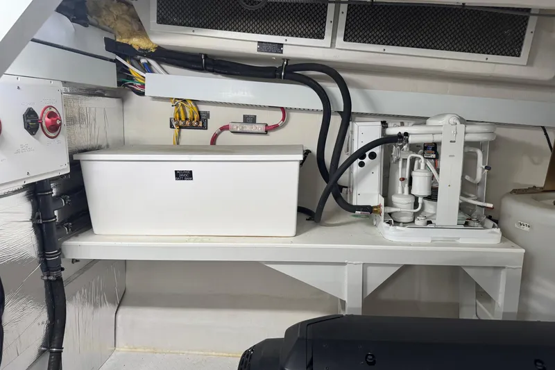 Slide: The Image of Engine room of 2022 Cruisers Yachts 54 Cantius, featuring electrical and mechanical components. - 79