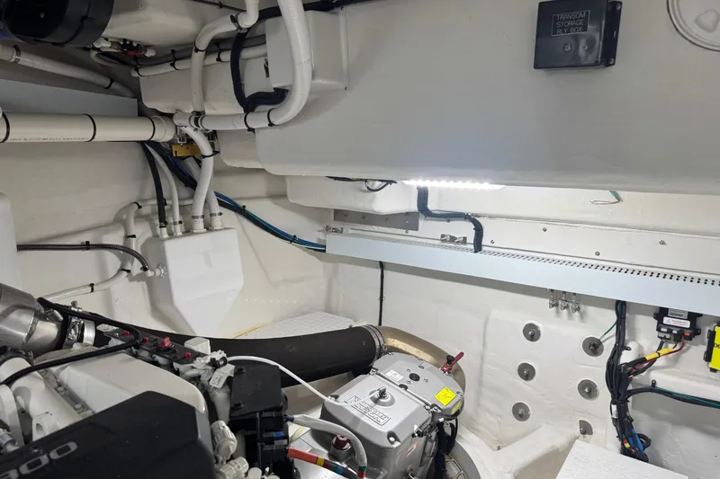 Slide: The Image of Engine room of 2022 Cruisers Yachts 54 Cantius, showcasing mechanical components and wiring. - 81