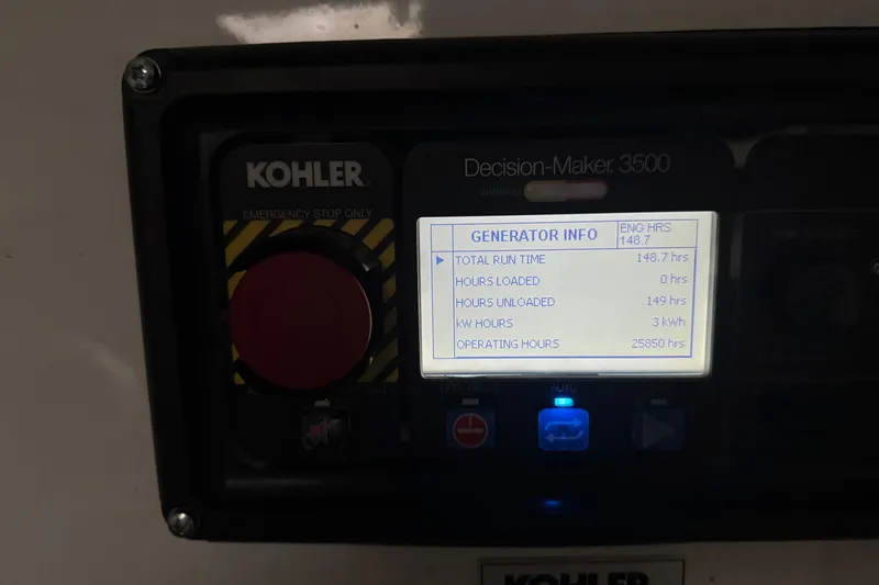 Slide: The Image of Kohler generator control panel on 2022 Cruisers Yachts 54 Cantius, displaying operational data. - 86
