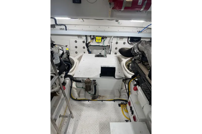 Slide: The Image of Engine room of 2022 Cruisers Yachts 54 Cantius, showcasing mechanical components and systems. - 89