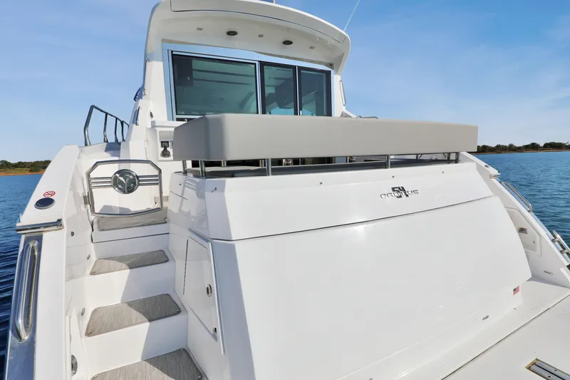 Slide: The Image of 2022 Cruisers Yachts 54 Cantius luxury yacht, rear view with elegant design features. - 23