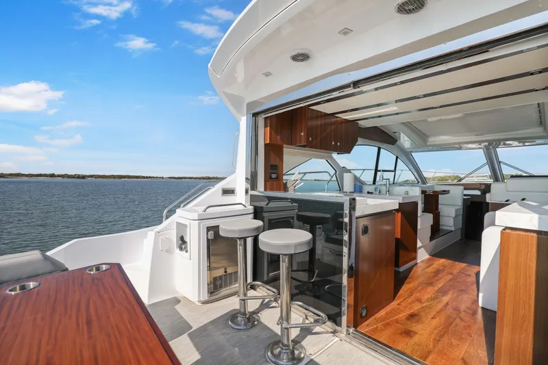 Slide: The Image of Luxurious 2022 Cruisers Yachts 54 Cantius interior with open deck and modern amenities. - 28