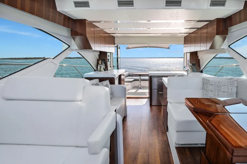 Slide: The Image of Luxurious interior of 2022 Cruisers Yachts 54 Cantius with elegant wood and white furnishings. - 34