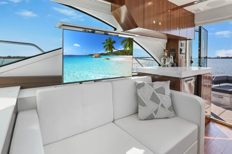 Slide: The Image of Luxurious interior of 2022 Cruisers Yachts 54 Cantius with modern decor and scenic ocean view. - 40