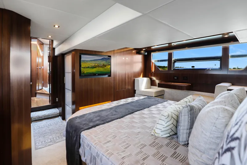 Slide: The Image of Luxurious interior of 2022 Cruisers Yachts 54 Cantius with elegant wood paneling and modern amenities. - 68