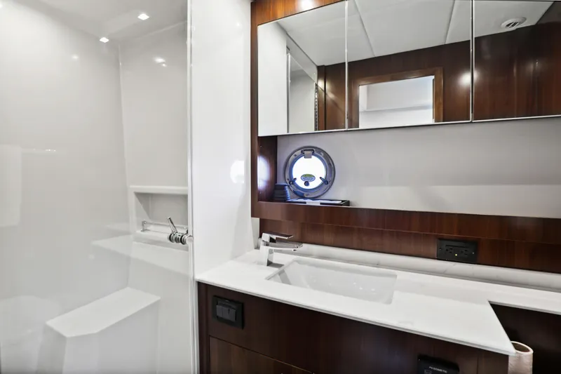 Slide: The Image of Luxurious bathroom in 2022 Cruisers Yachts 54 Cantius, featuring sleek design and modern fixtures. - 70