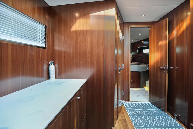 Slide: The Image of Luxurious interior of 2022 Cruisers Yachts 54 Cantius with wood paneling and modern design. - 71