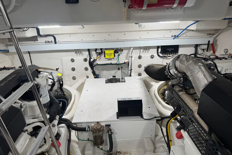 Slide: The Image of Engine room of 2022 Cruisers Yachts 54 Cantius, showcasing advanced marine machinery. - 74