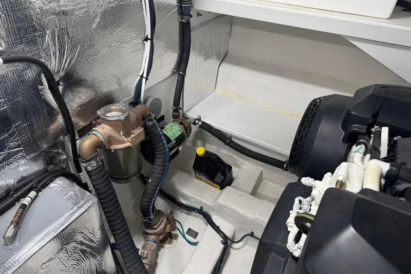 Slide: The Image of Engine room of 2022 Cruisers Yachts 54 Cantius with visible components and wiring. - 78