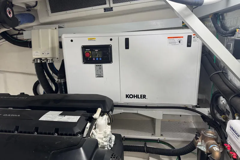 Slide: The Image of Engine room of 2022 Cruisers Yachts 54 Cantius with Kohler generator. - 84