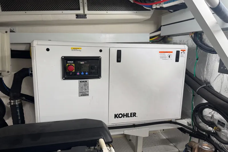 Slide: The Image of Engine room of 2022 Cruisers Yachts 54 Cantius with Kohler generator. - 85