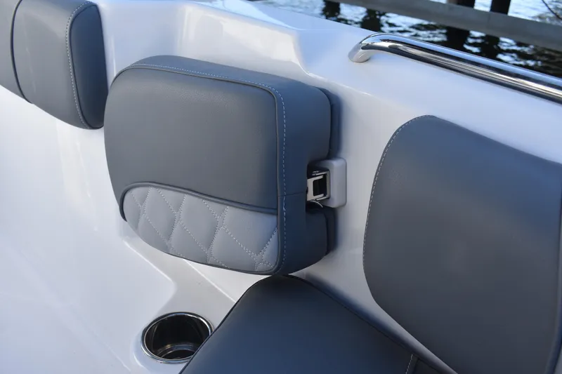 Slide: The Image of 2025 NauticStar 251 Hybrid boat interior with gray cushioned seating and cup holder. - 43