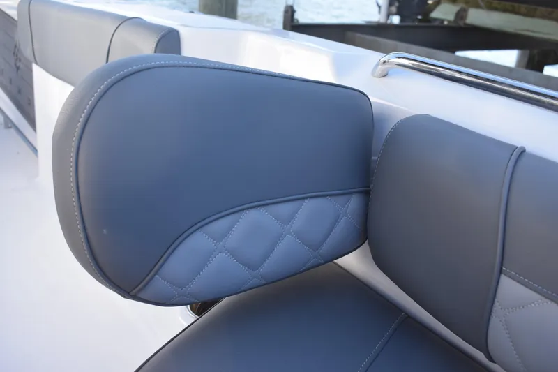 Slide: The Image of 2025 NauticStar 251 Hybrid boat seat with elegant gray upholstery and quilted design. - 44