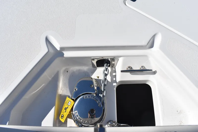 Slide: The Image of Anchor locker of 2025 NauticStar 251 Hybrid boat with chain and cleat. - 48