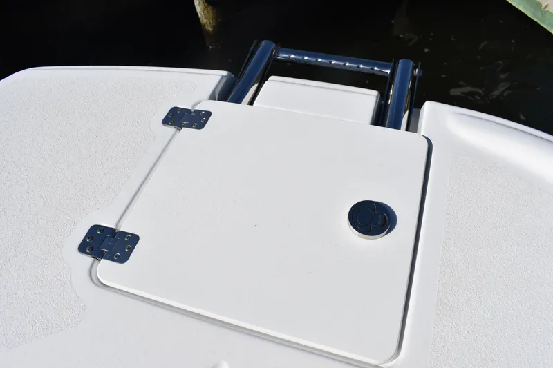 Slide: The Image of 2025 NauticStar 251 Hybrid boat hatch with stainless steel hinges and handle. - 49