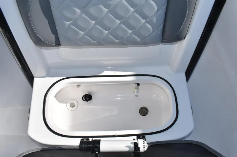 Slide: The Image of Livewell compartment in 2025 NauticStar 251 Hybrid boat, featuring quilted seating. - 52