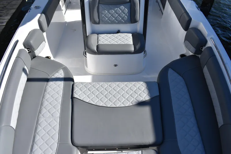 Slide: The Image of 2025 NauticStar 251 Hybrid boat interior with gray and white quilted seating. - 56